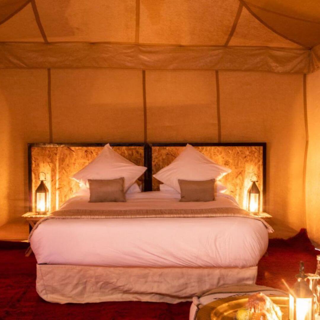 Opulent luxury tent at Agafay desert, showcasing luxurious decor, comfortable seating, and breathtaking desert views